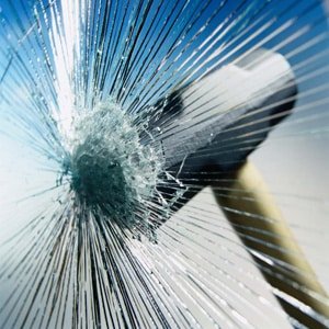 Impact cracking glass while fragments remain together
