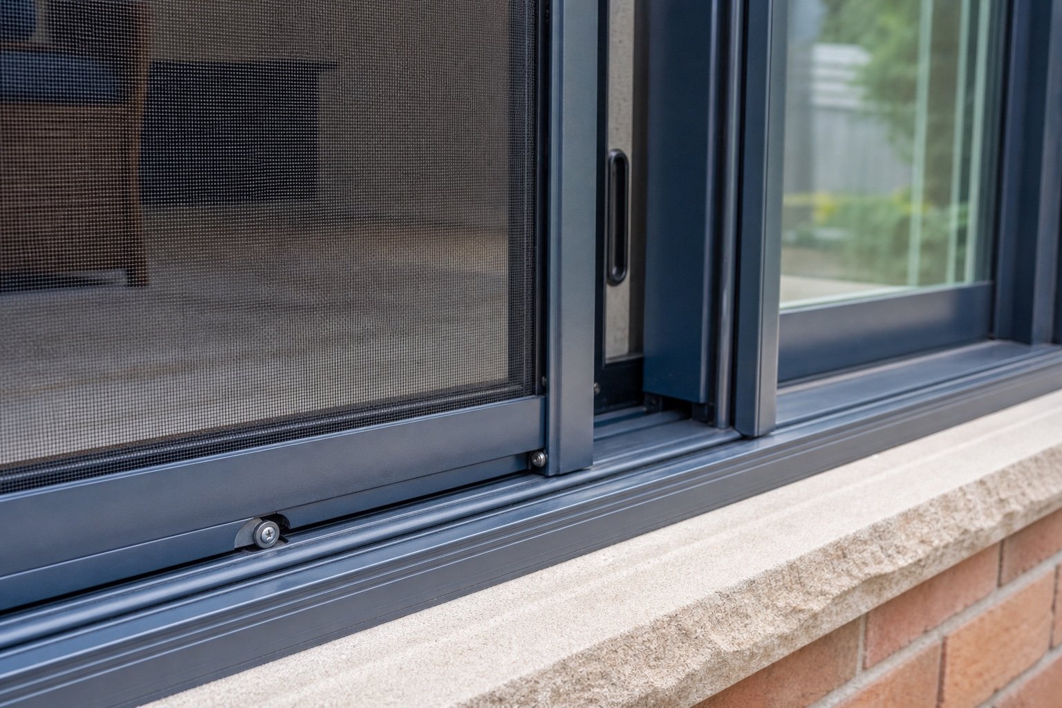 Patio-door insect screen, roller and track detail