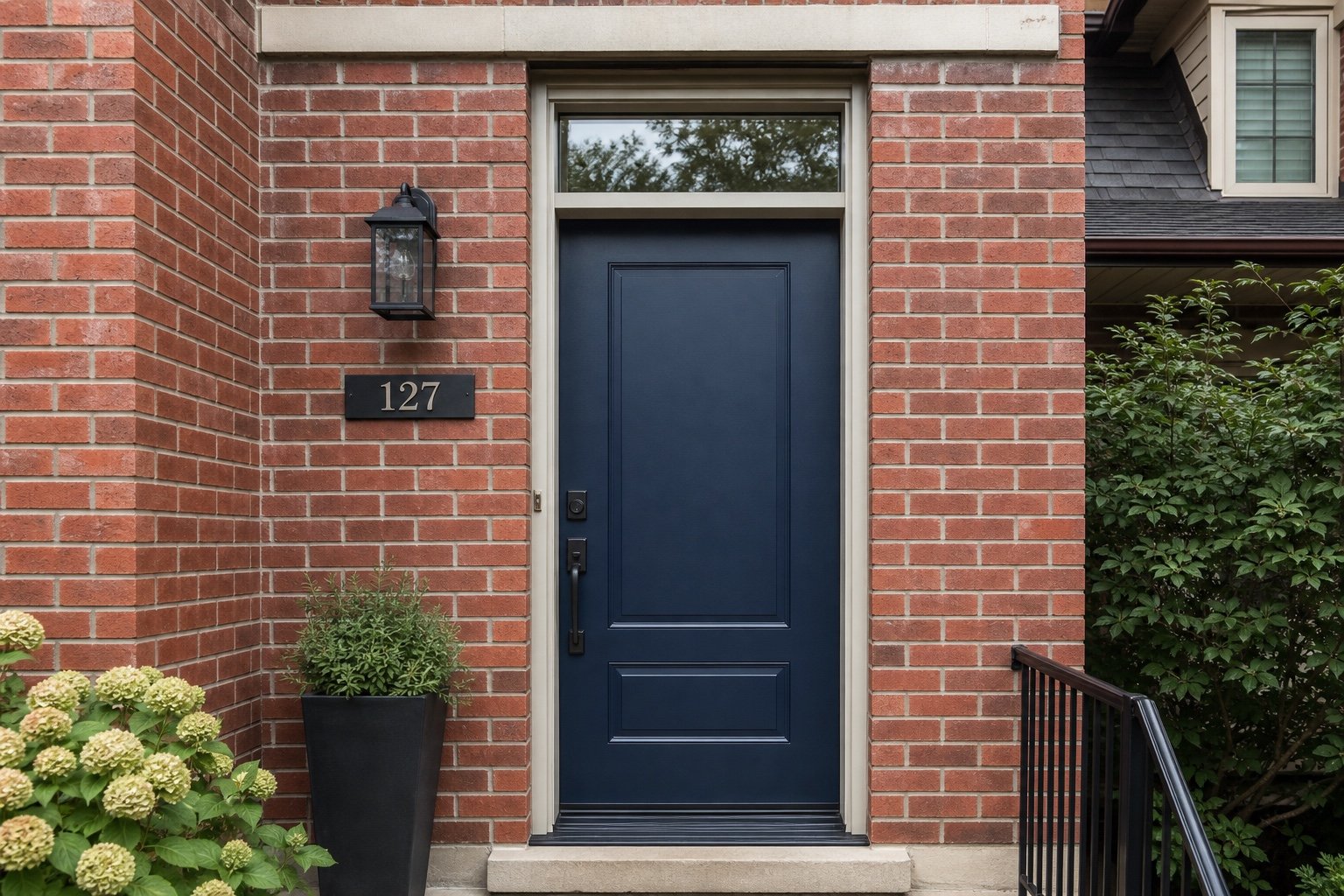 Single navy entry door with a rectangular transom
